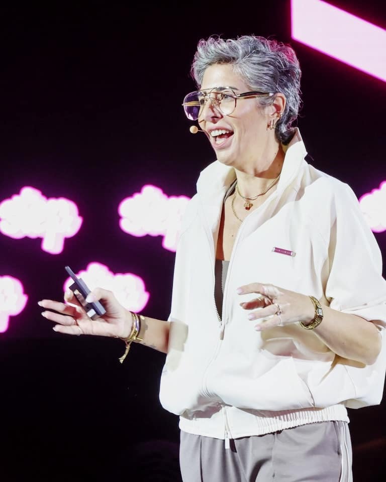 A speaker on the pink AI Stage at Step Dubai 2026